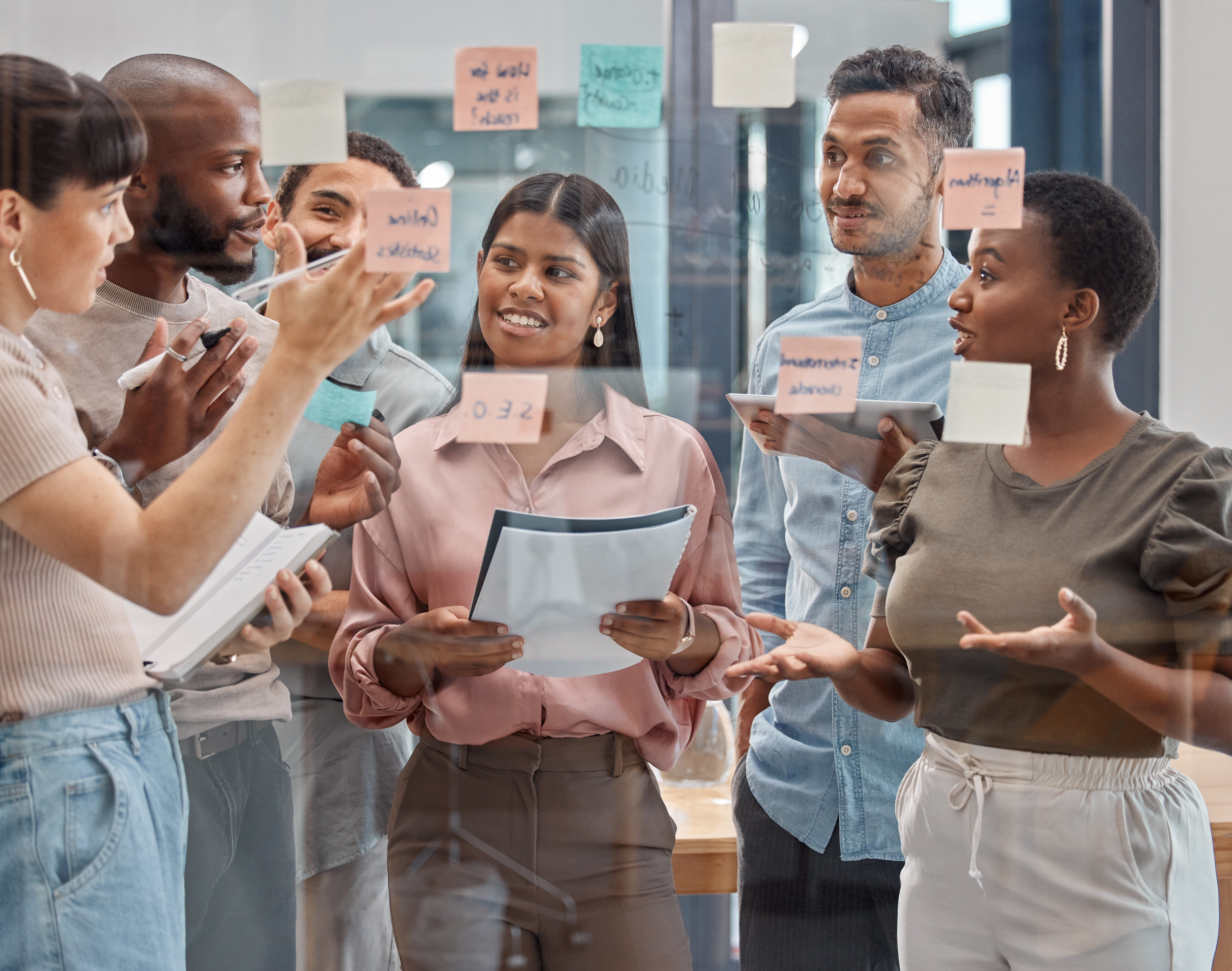 Shot of a group of young businesspeople having a discussion at the office.